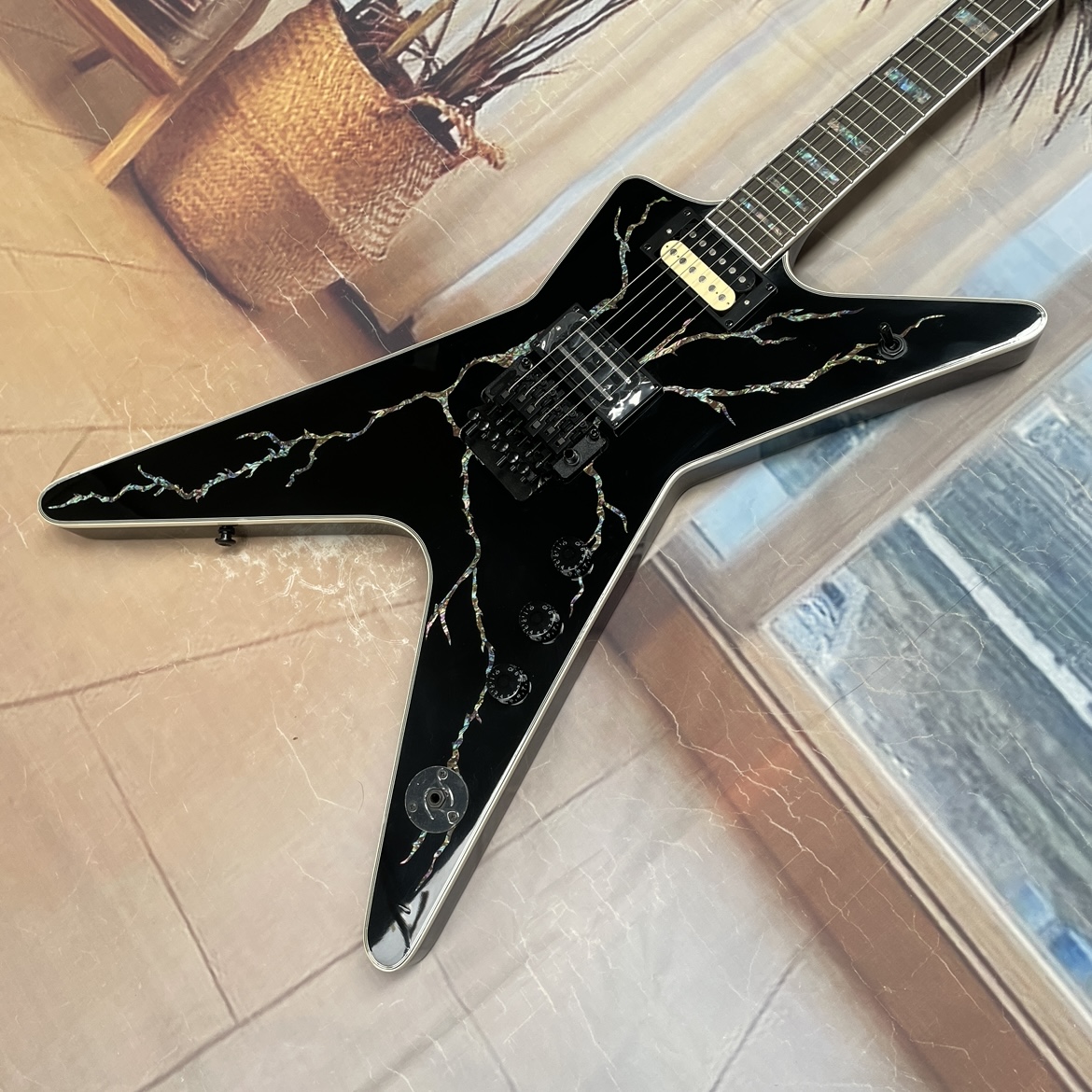 Electric Guitar Beginner - 6-string black electric guitar with abalone